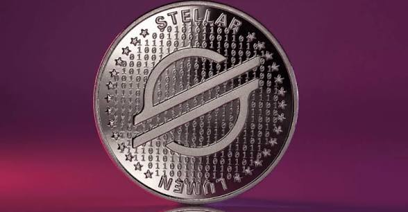 A silver coin featuring a stylized 'S' logo surrounded by stars and binary code, with the text 'STELLAR' and 'STELLAR NEWMI' visible.
