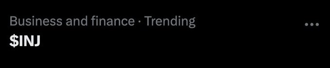 A dark screenshot showing a business and finance trending ticker displaying '$INJ'.