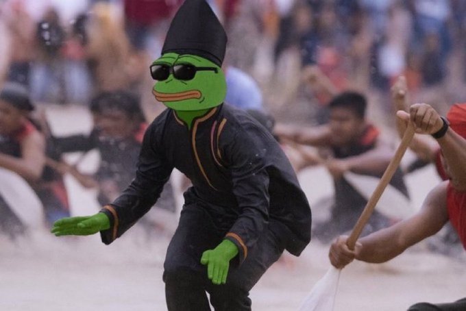 A person dressed as Pepe the Frog in black martial arts attire and sunglasses in what appears to be a dragon boat race scene.