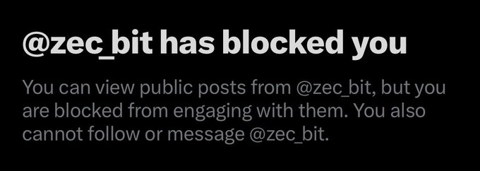 The image displays a Twitter message that says "@zec_bit has blocked you" and explains that the user can still view public posts from @zec_bit but is blocked from engaging with them or following/messaging the account.

The image relates to the post because @zec_bit, who had promoted ZCash (ZEC) NFTs as a scam project, has blocked the user—likely in response to the user's criticism questioning the legitimacy of ZCash NFTs and calling out @zec_bit as a "money extractor."
