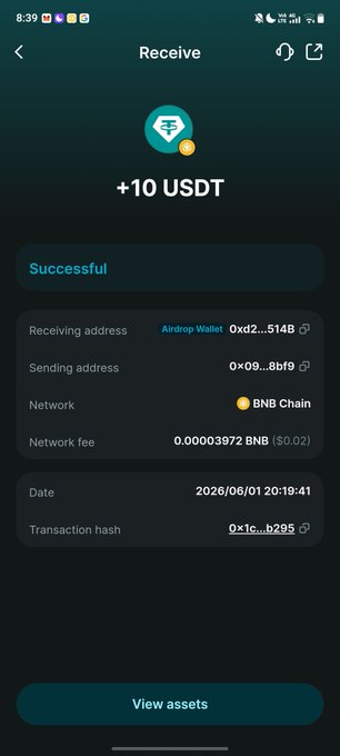 The image shows a cell phone screen displaying a message about receiving 10 USDT. The text "Receiving 10 USDT" is prominently displayed, along with an image of a diamond symbolizing a successful transaction. The background color of the image is blue, and there are two thumbs up icons in the bottom right corner.