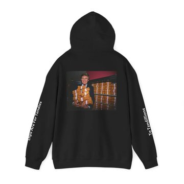 A black hoodie laid flat against a white background, featuring a printed image of a man in a gold vest standing in front of a building, with 'revolution' text down the sleeves.