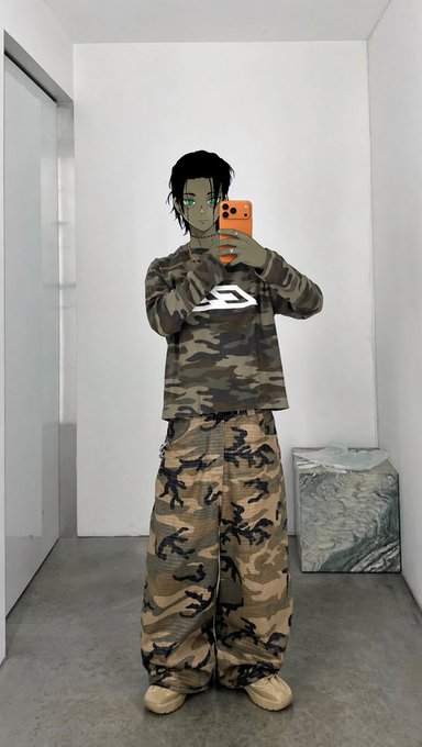 A mirror selfie captures a person with short dark hair and green eyes wearing a green camouflage long-sleeve shirt, camouflage cargo pants, and tan Yeezy-style shoes.