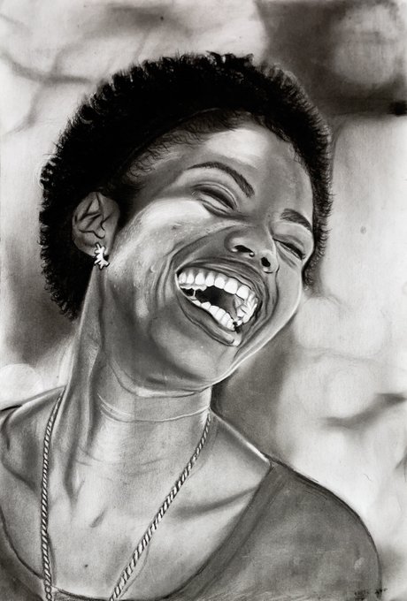 A black-and-white pencil drawing portrait of a woman with short hair laughing joyfully with her eyes closed, wearing an earring and necklace.