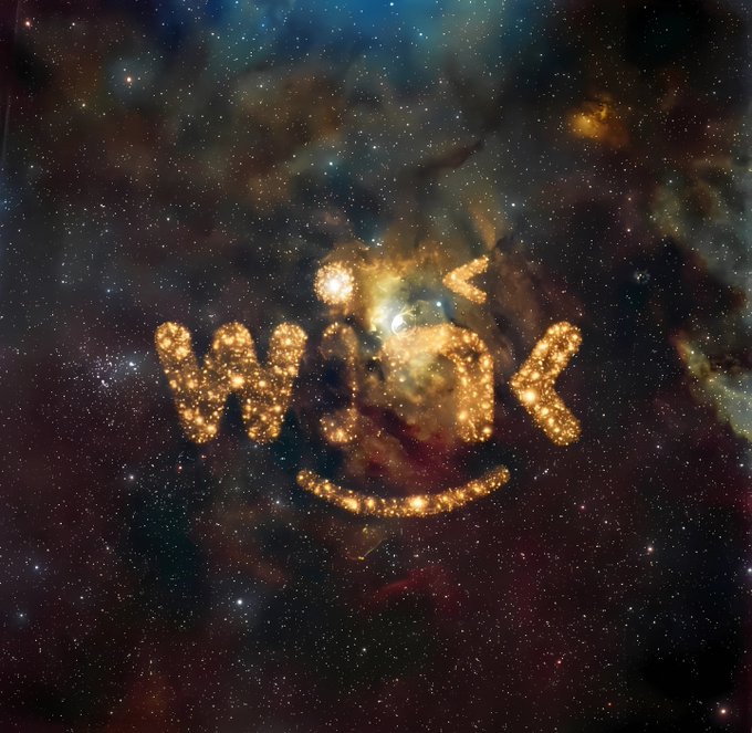 A cosmic space background with stars and nebulae features the word 'work' written in glowing golden particle text with a smile underneath.