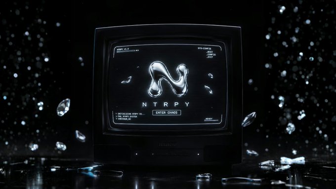 A retro CRT television displaying a glowing 'N' logo with the text 'NTRY' and 'ENTER CHAOS', surrounded by floating crystal shards in a dark environment.