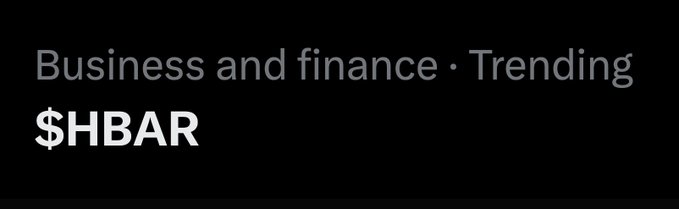 A black banner image with gray and white text reading "Business and finance · Trending" above the ticker "$HBAR" in bold white letters, indicating that the Hedera cryptocurrency is currently trending in the business and finance category.