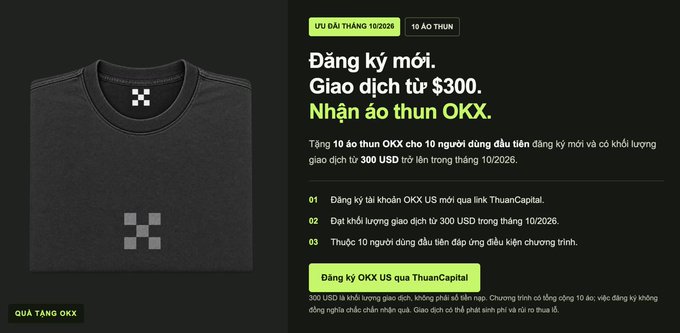 Promotional advertisement for OKX cryptocurrency exchange featuring a black t-shirt giveaway, with Vietnamese text announcing a campaign where the first 10 people to register and trade from $300 will receive a free OKX t-shirt, running through 10/2026.