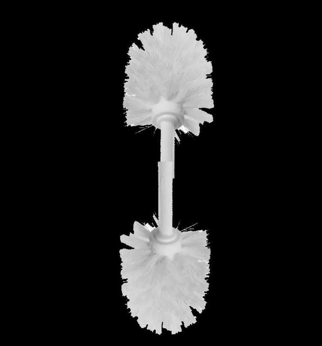 A close-up product shot shows a white, double-sided toilet brush with a central handle connecting two bristled brush heads against a solid black background.