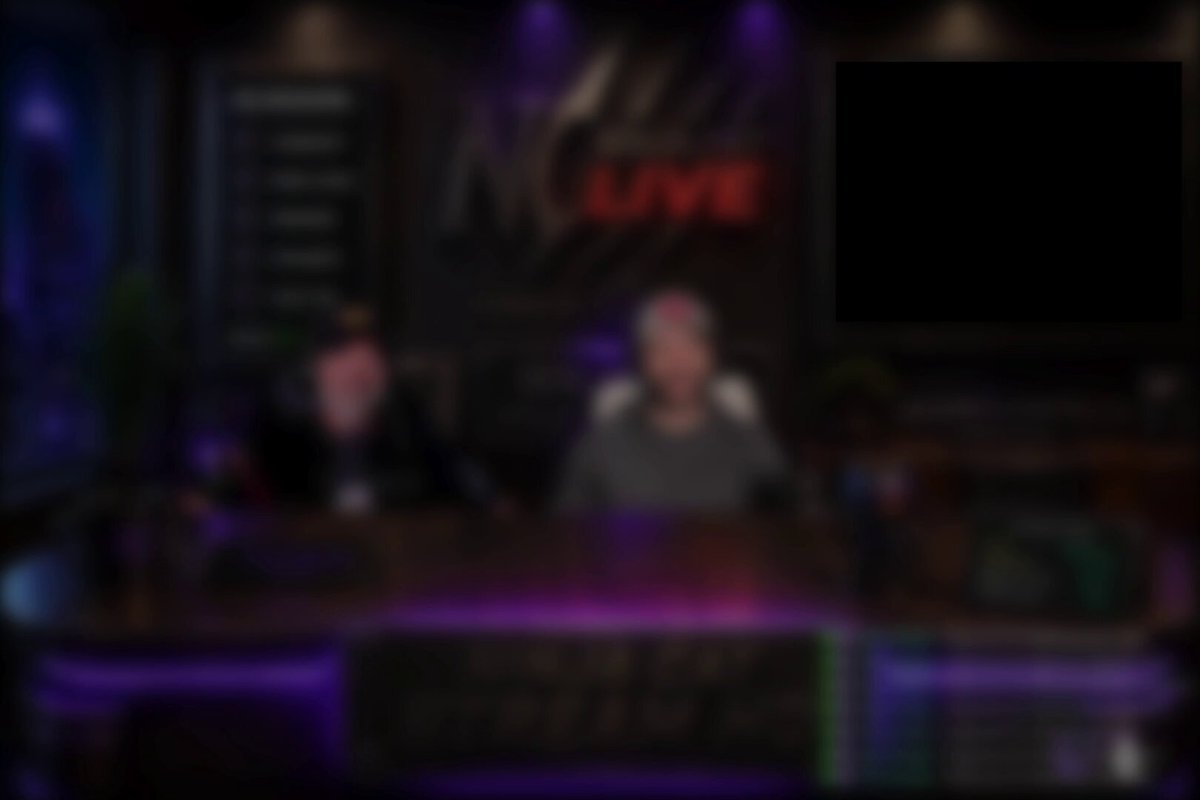 The image shows a television screen displaying a live broadcast of two people sitting behind a desk, with a microphone in front of them. The background features a dark room with purple lighting, creating an atmosphere for the show. A banner reading "NICE STREAMING" is visible on the wall above the desk. The post also mentions that there are cool giveaways up for grabs and that it's going to be amazing.