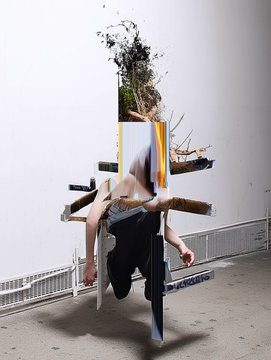 Artistic photo of a person in athletic wear appearing to crash through or fall against a white gallery wall with shattered plaster effects.