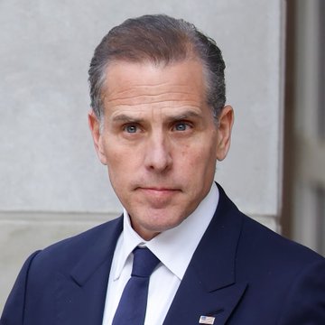 The image features a man dressed in a suit and tie, standing against a white wall or building background. The man appears to be looking directly at the camera with an expression of concern or seriousness. The caption provided in the image reads "Former President Joe Biden'S son, Hunter Biden, says: 'When I decided to sell my art, I wanted every piece on the blockchain and to accept Bitcoin as payment.'" This statement is likely related to the man's involvement in the art world, possibly discussing his experiences or opinions about the current state of the art market.