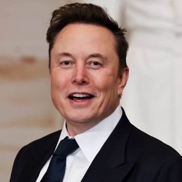 The image shows a close-up portrait of Elon Musk in a dark suit and tie. The accompanying post quotes Musk’s Bitcoin-related message, emphasizing that money is being devalued through inflation and that scarce assets such as Bitcoin are presented as a path to financial freedom.