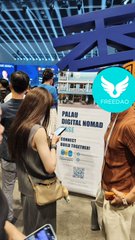 The FREEDAO team is showcasing their "Polas Digital Nomad" signage at Bitcoin Asia, featuring their distinctive owl logo. The booth display with a QR code suggests visitors can learn more about their Web3 community, aligning with the post's announcement of FREEDAO's presence at the Hong Kong conference to connect with Web3 builders and creators.