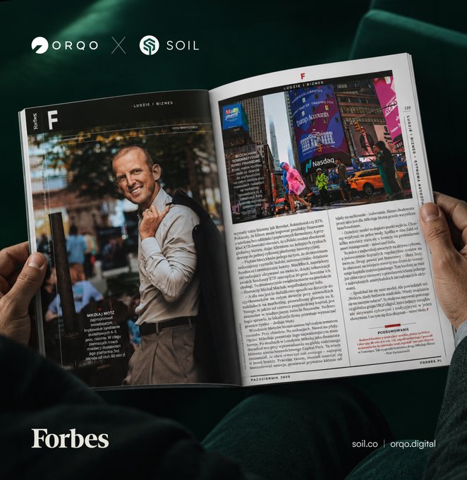 A person reading a Forbes magazine spread featuring Mikolaj Motz, with branding for ORQO and SOIL visible, and the URL soil.co | orqo.digital in the corner.