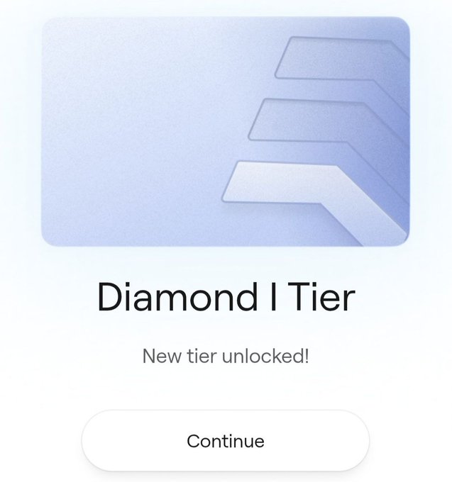 A digital achievement screen with a light purple card design featuring a geometric logo, displaying the text 'Diamond I Tier' and 'New tier unlocked!' above a 'Continue' button.