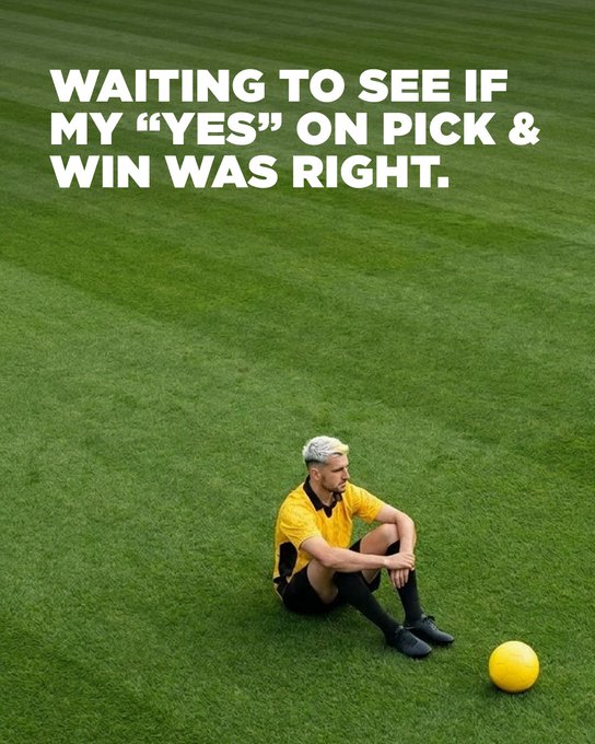 A referee in a yellow uniform sits alone on a lush green soccer field, looking contemplatively at a yellow ball beside him, with the bold text "WAITING TO SEE IF MY 'YES' ON PICK & WIN WAS RIGHT." overlaying the scene. The image ties into the post by capturing the anxious anticipation of a Pick & Win prediction on Binance, where the referee's reflective moment mirrors the uncertainty of awaiting the outcome of a "Yes" or "No" sports prediction.