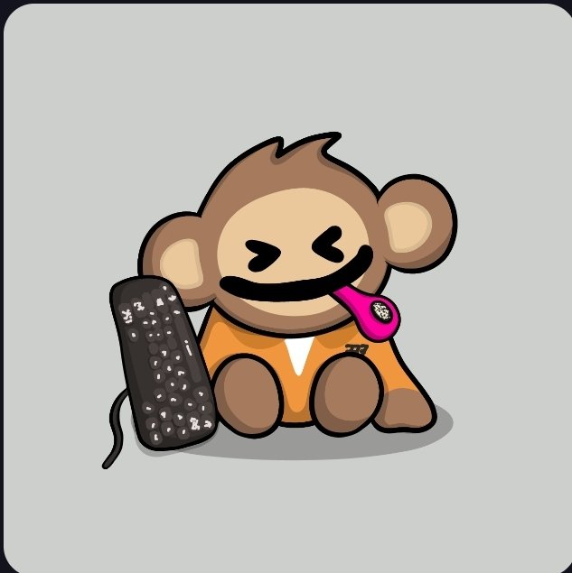 A cartoon illustration of a brown monkey mascot wearing an orange outfit, with eyes closed and tongue out, sitting next to a black computer keyboard covered in crumbs.