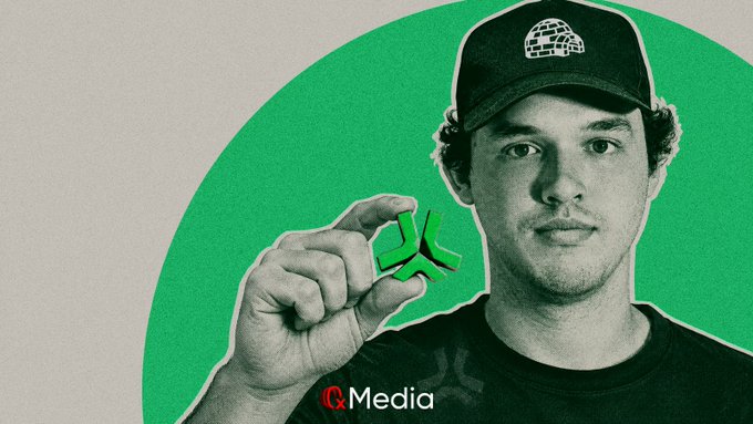 A black and white cutout photo of a young man wearing a cap holding a green 3D logo in his fingers against a green background with the text 'C Media' visible at the bottom.