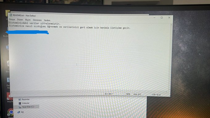 A computer monitor displays a READMEx64 - Not Defteri text file containing Turkish text with a line marked in blue.
