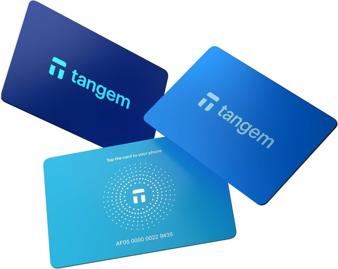 Three Tangem cards are displayed in shades of blue, with two showing the 'tangem' logo and one featuring the instruction 'Tap the card to your phone' along with the number 'AF05 0000 0022 9435'.