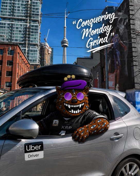 An Uber driver wearing a jaguar-patterned XRP mask, purple sunglasses, and a beret poses in his car with a rooftop cargo box, beneath a "Conquering Monday Grind" caption and the CN Tower in the background—visually embodying the post's message about grinding hard on Monday while representing the XRP crypto community.

Key text visible: "Conquering Monday Grind," Uber Driver, XRP.