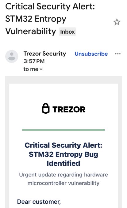 A Gmail inbox message from Trezor Security with the subject 'Critical Security Alert: STM32 Entropy Vulnerability' announcing a 'Critical Security Alert: STM32 Entropy Bug Identified'.
