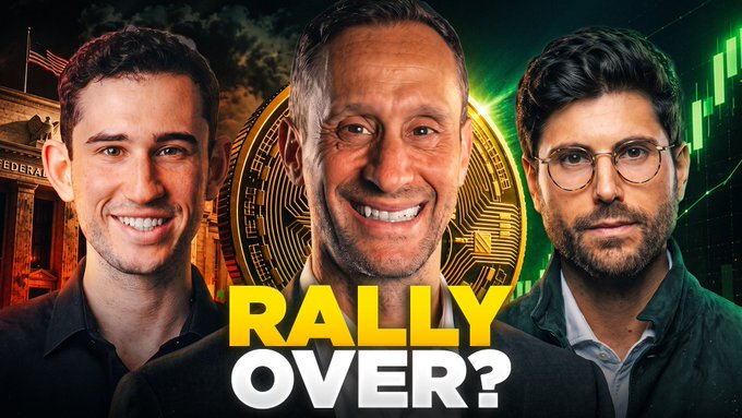 The image shows three men with a large Bitcoin coin graphic behind them and bold text reading "RALLY OVER?" The thumbnail, which relates to a discussion about Bitcoin's recent 20% rally, features Anthony Pompliano, a central smiling figure, and another commentator, set against a backdrop blending a U.S. Federal Reserve building with green trading chart graphics.