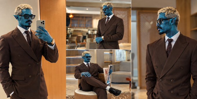 Four images showing a person or figure in a brown double-breasted suit with a blue alien-like face and blonde hair, shown taking mirror selfies and sitting reading in an elegant indoor setting.