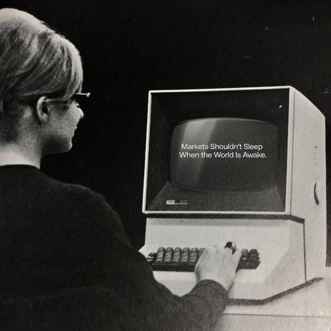 A vintage computer monitor displays the text "Markets Shouldn't Sleep When the World is Awake," while a person wearing glasses operates its keyboard. The retro imagery reinforces the post's message about outdated trading hours, suggesting that traditional "market closed" limitations are obsolete in a 24/7 global economy.