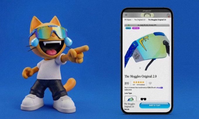 The image features an orange cat figurine wearing sunglasses, standing next to a smartphone displaying an item for sale called "The Mogules Original 2.0". The cat figurine appears to be pointing at the phone screen, possibly suggesting that the item is worth considering as a gift or purchase. The post about Hunter Biden and mogging has been shared on social media, with the image being used to promote the product.
