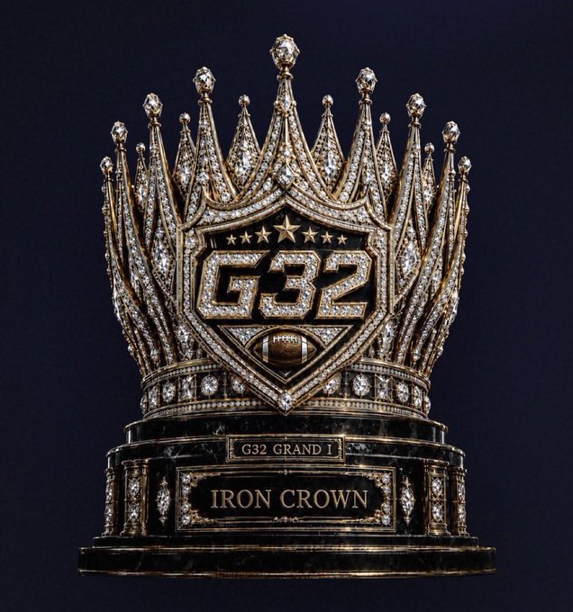 An ornate, diamond-encrusted crown with a central shield displaying 'G32', sitting on a base engraved with 'G32 GRAND 1' and 'IRON CROWN'.