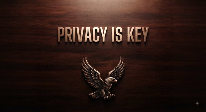 A dark wooden background with the text 'PRIVACY IS KEY' above a metallic eagle emblem.
