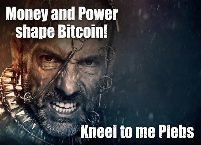 The image shows a close-up of a menacing warrior's face (appearing to be from a fantasy film) with facial piercings, war paint, and sharp teeth bared in an aggressive expression. Bold text overlays read "Money and Power shape Bitcoin!" at the top and "Kneel to me Plebs" at the bottom, reinforcing the post's sentiment that corporate entities and elites seek to control Bitcoin through financial influence rather than genuine contribution.