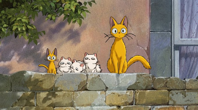 An animated scene showing a family of cats—one large orange cat and several smaller kittens—sitting on a stone wall beneath a leafy tree.