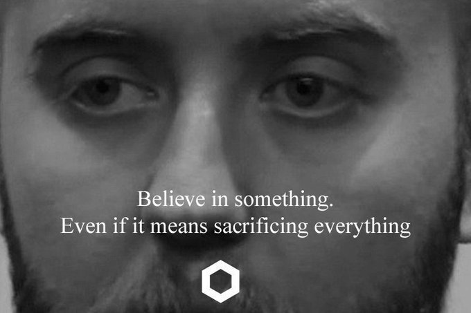 A black and white close-up of a man's face with the Nike logo and the text 'Believe in something. Even if it means sacrificing everything.'