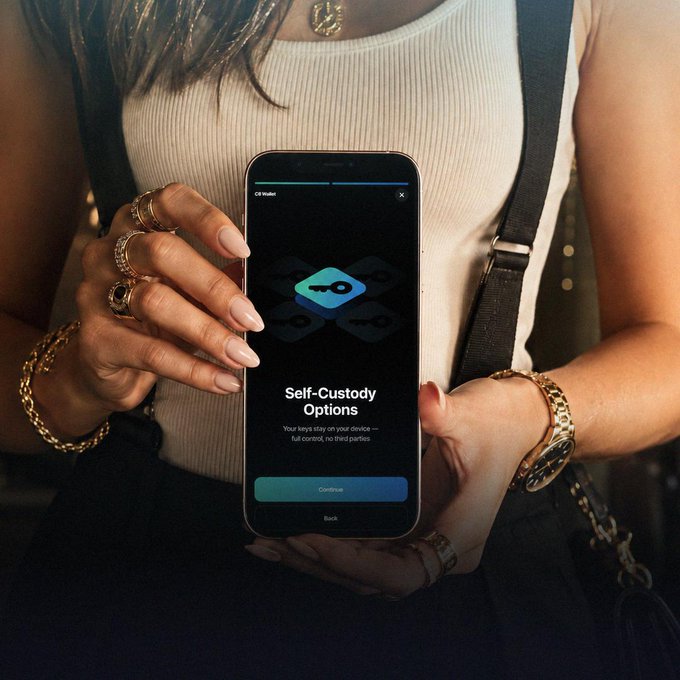 A woman wearing a white tank top, gold jewelry, and rings holds a smartphone displaying the OKX Wallet app's 'Self-Custody Options' setup screen with a 'Continue' button.