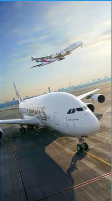 An Emirates Airbus A380 taxis on a runway as another Emirates plane takes off in the background, with the airline's name clearly visible on both aircraft. The image visually supports the news about Emirates launching crypto payment integration for flight bookings through Crypto.com Pay.