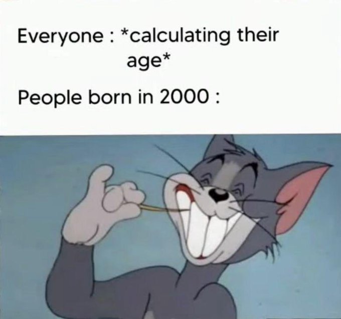A meme featuring Tom from Tom and Jerry with a wide grin and thumbs up, with text reading "Everyone: *calculating their age* People born in 2000:" poking fun at the simplicity of figuring out their age in the current year.