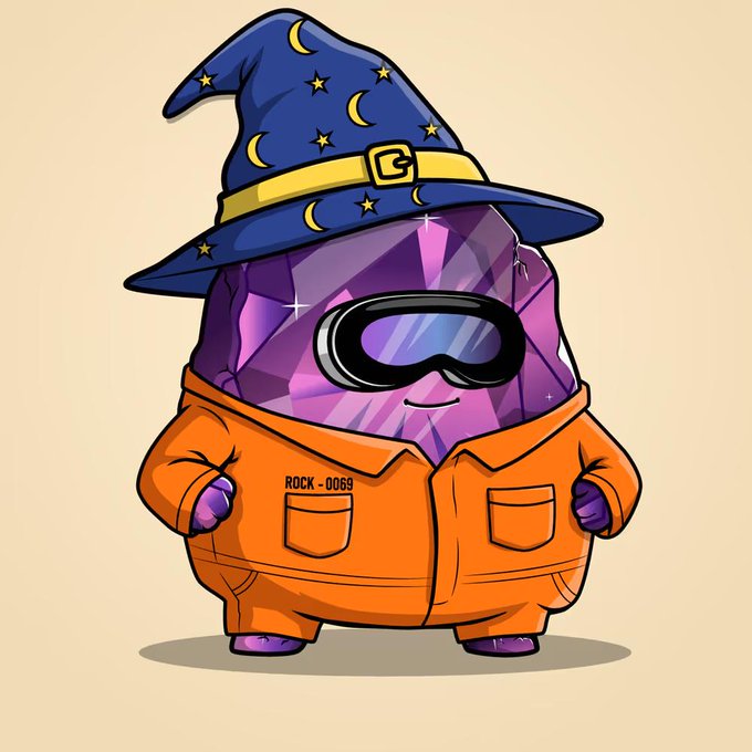 A cartoon purple crystal rock mascot wearing a blue wizard hat decorated with moons and stars, futuristic ski goggles, and an orange prison-style jumpsuit labeled 'ROCK - 0069'.