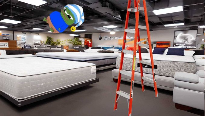 A mattress showroom displays various beds with brand signs like 'Kingsdown' visible, featuring a humorous juxtaposition of a cartoon baby wearing a sleep mask falling from the ceiling and an orange ladder standing in the aisle.