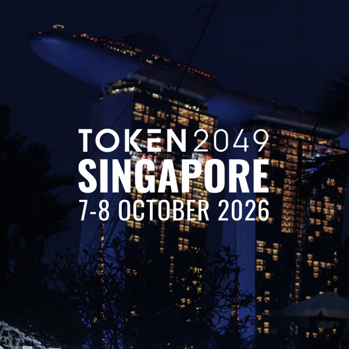 A nighttime view of Singapore's iconic Marina Bay Sands skyline serves as the backdrop for the TOKEN2049 Singapore conference text, dated 7-8 October 2026. The promotional image complements the team's announcement about attending the event and meeting fellow builders in Singapore.