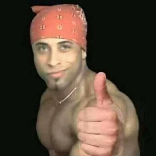 A shirtless man wearing a red patterned bandana gives a thumbs-up gesture toward the camera against a black background.
