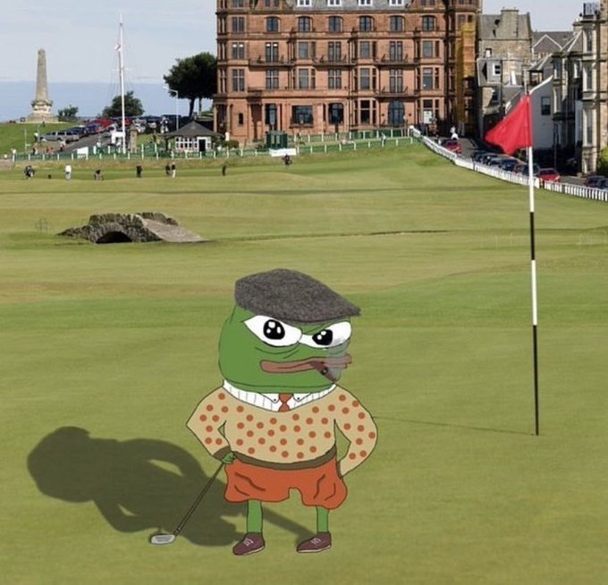 A cartoon Pepe the Frog character wearing a flat cap, polka dot sweater, and orange shorts, holding a golf club on a golf course with a red flag in the hole.