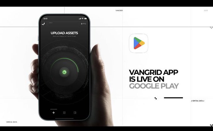 The image depicts a hand displaying the Vangrid app on a smartphone screen, showing an "UPLOAD ASSETS" feature with a green checkmark, alongside bold text announcing "VANGRID APP IS LIVE ON GOOGLE PLAY" with the recognizable Google Play logo.

The image directly supports the post by visually showcasing the Vangrid app's interface (specifically the asset upload feature referenced in the post's description of edge nodes capturing video walks), while simultaneously announcing the app's launch on Google Play—a key milestone for the spatial data layer project mentioned.