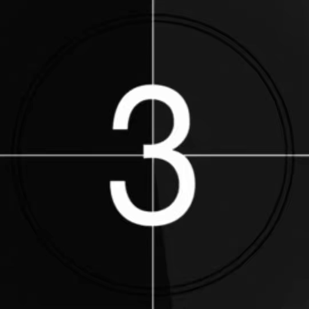 The image shows a black background with a white number 3 prominently displayed at the center, which appears to be slightly tilted or upside down compared to its usual position. Below this central figure is a small caption that reads "This is just the beginning of something big", suggesting a connection between the number and an upcoming event or series. The overall composition seems simple yet intriguing, emphasizing the significance of the number 3 and the possible implications it may hold.