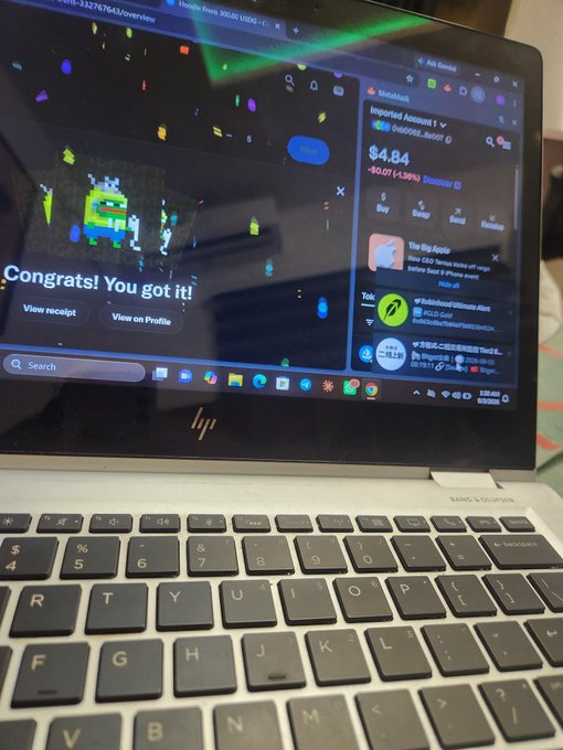 HP laptop screen showing 'Congrats! You got it!' message with confetti, alongside a MetaMask wallet showing $4.84, in what appears to be an NFT minting transaction.