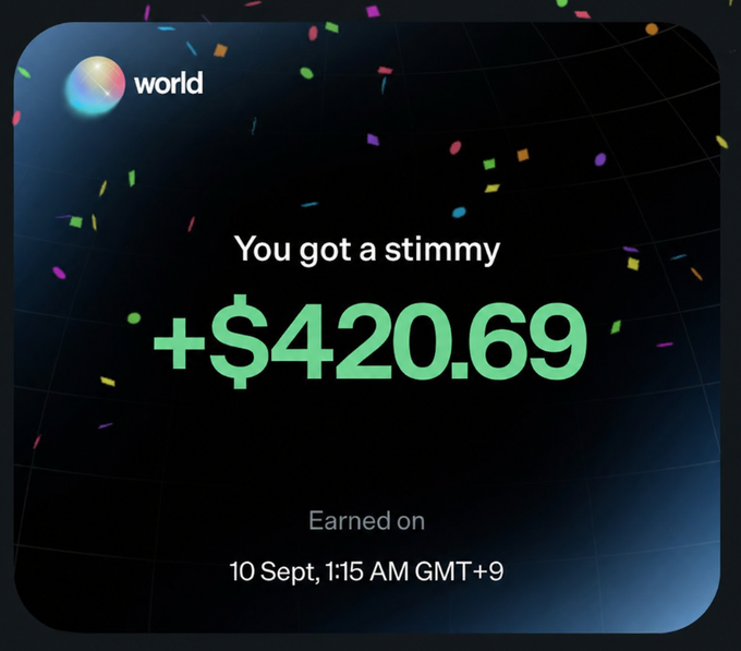 A Worldcoin app notification celebrating "You got a stimmy +$420.69 Earned on 10 Sept, 1:15 AM GMT+9" against a dark background with colorful confetti.
