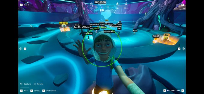 A screenshot from the video game Fortnite showing a character in a blue dress taking a selfie, with a user named "ROBSCO0" visible at the top and various player names like "ZerX - William" floating above in a neon-lit environment.