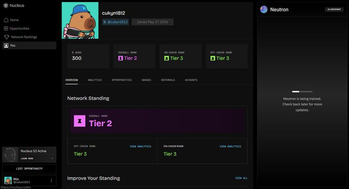 A user profile page on the Nucleus platform for user 'cukuni812' (@cukuni1812), showing a Tier 2 overall rank, Tier 3 off-chain and on-chain ranks, 300 $NUSA tokens, and an AI assistant 'Neutron' that is currently being trained.